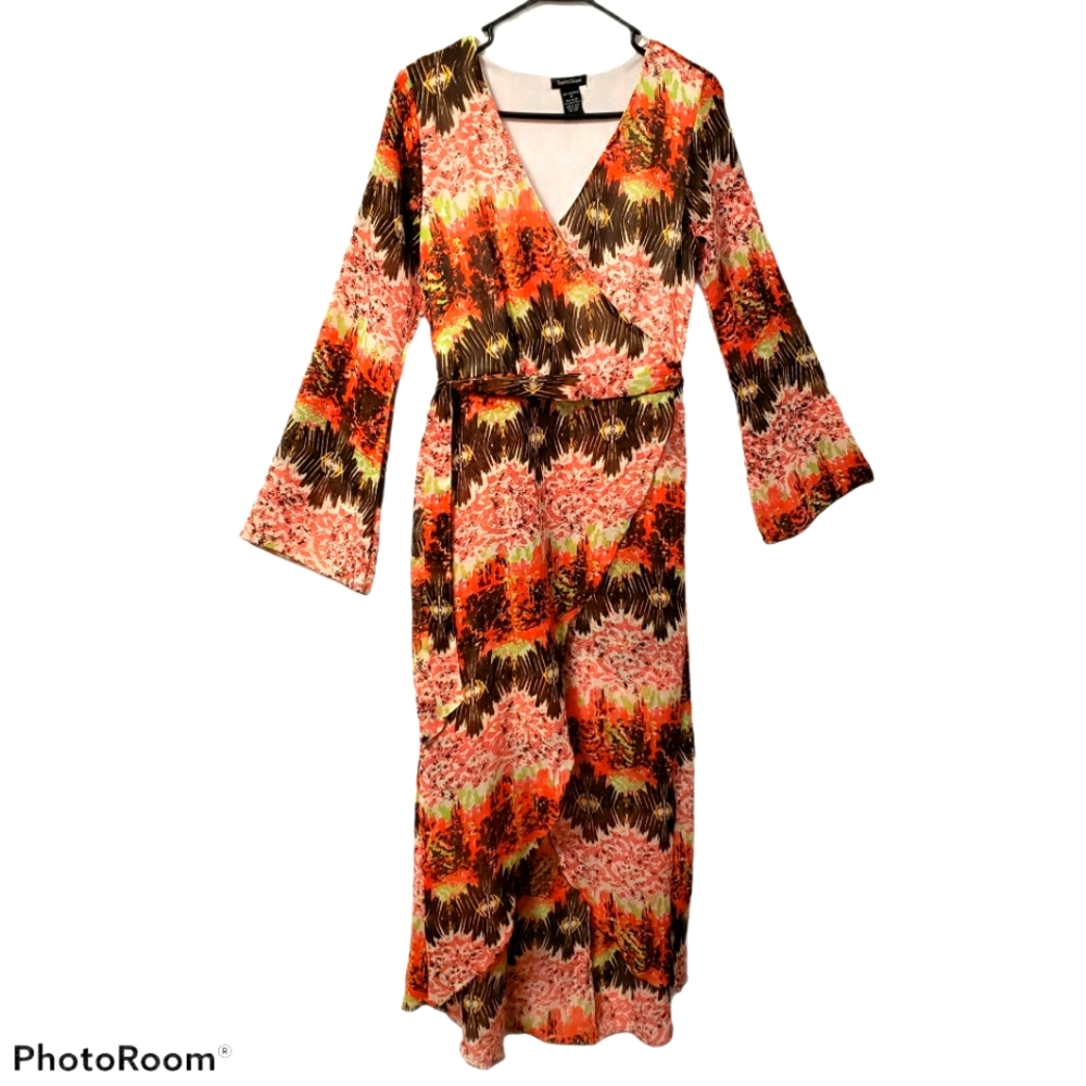 Norma Allen dress med featuring a vibrant orange and brown patterned print.
